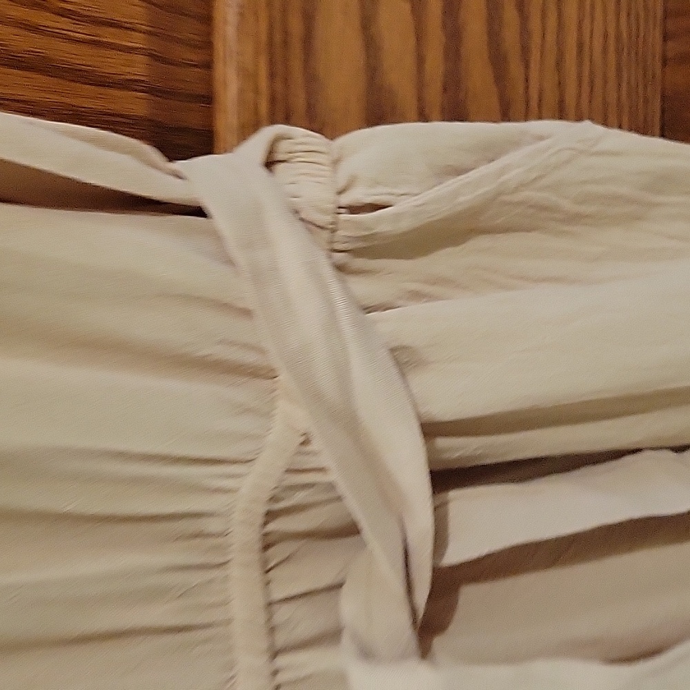 This is a womens linen jumpsuit in a tan color, size large. - Picture 3 of 4